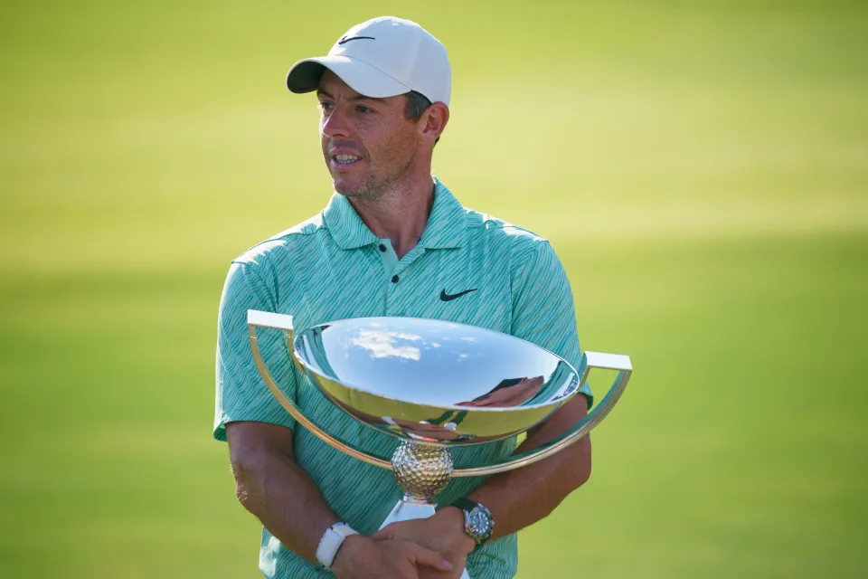 Rory McIlroy holds aloft the Tour Championship trophy