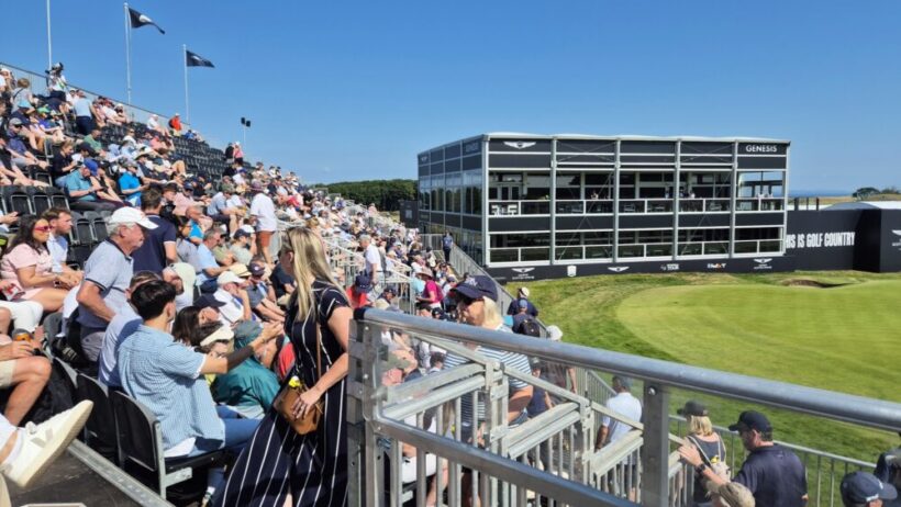 English golfer leads by three as crowds roll in