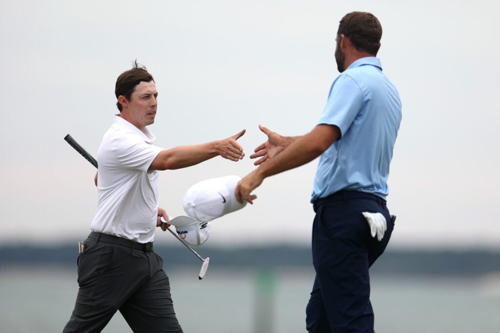 Matthew Fitzpatrick and Scottie Scheffler on the 18th green at the RBC Heritage at Harbour Town Golf Links