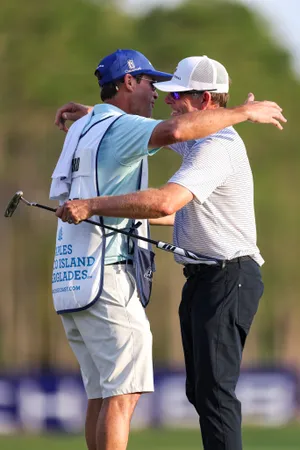 Justin Leonard of the United States reacts with his caddie, Shawn Segars on the 18th hole after his win of the Chubb Classic 2025 at Tiburon Golf Club on February 16, 2025 in Naples, Florida.