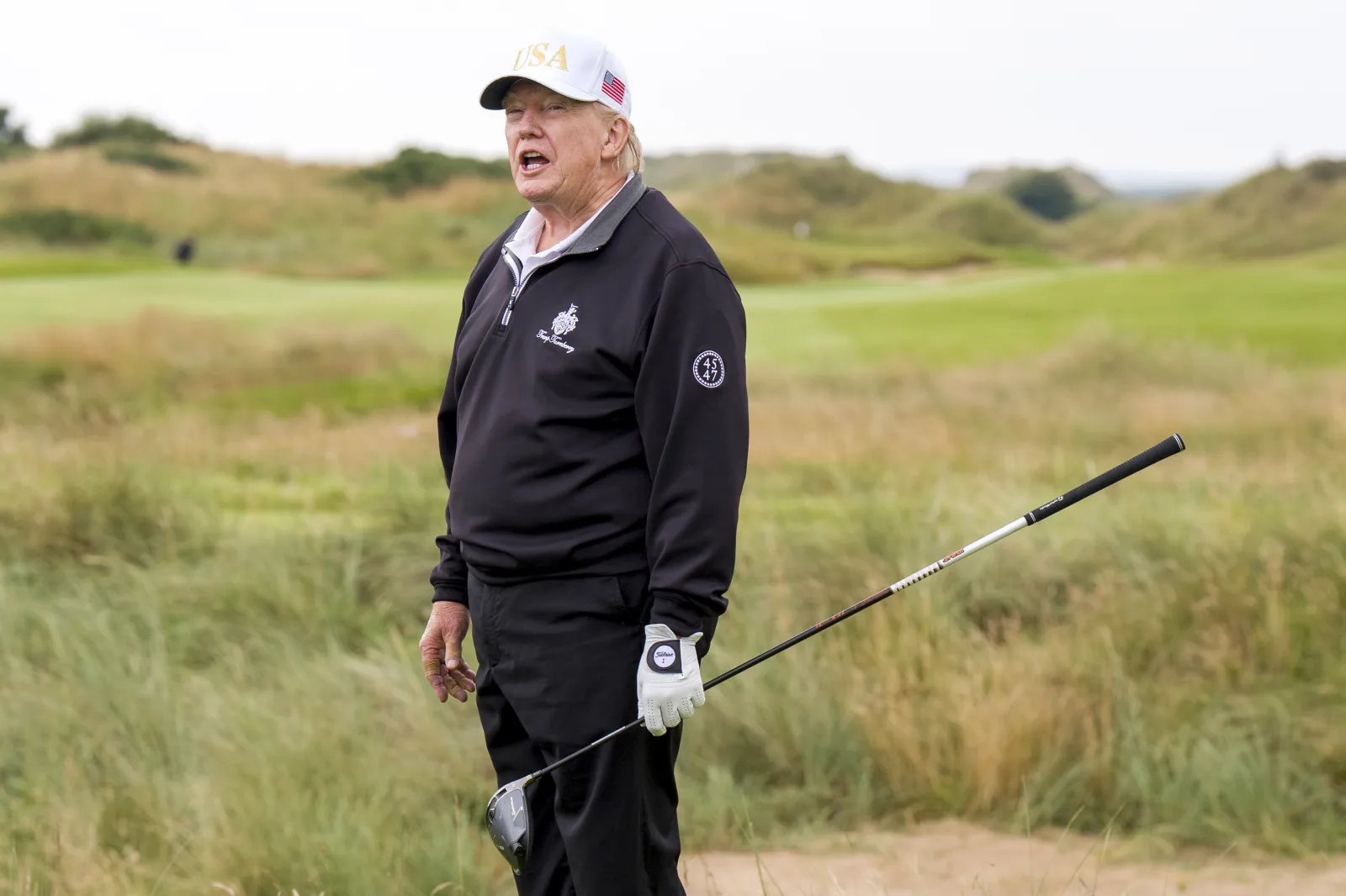President Donald Trump, on the first tee during the official opening of the New Course, the second championship course at Trump International Golf Links, on the Menie Estate in Balmedie, Aberdeenshire, on Tuesday July 29, 2025. (Press Association via AP Images)