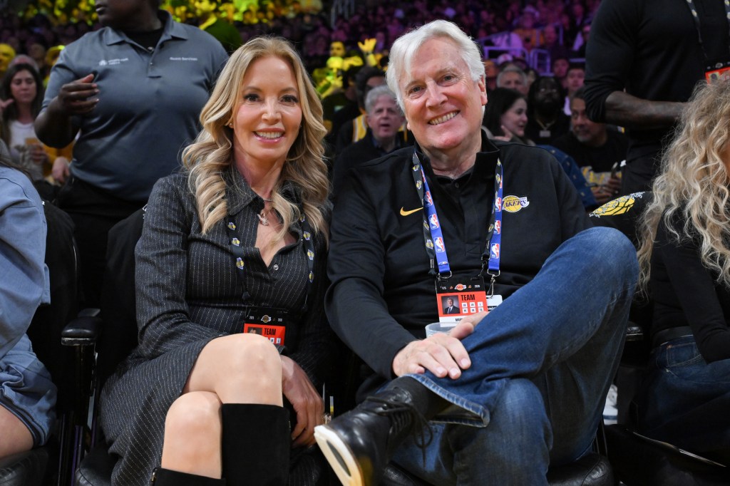 Jeanie Buss, left, and Mark Walter attend a basketball game between the Los Angeles Lakers and the Golden State Warriors