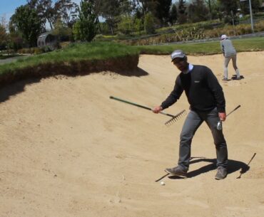 Golf Rules - Ball at rest against rake in bunker www.golfisanattitude.com