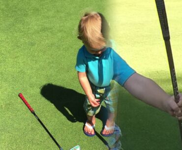 Thomas does his first golf swing with his mom