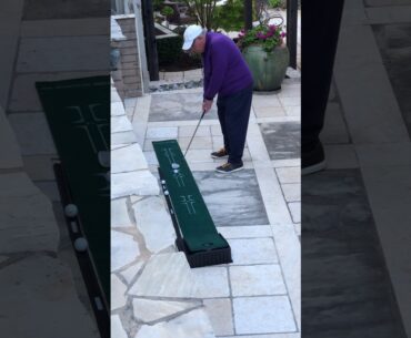 Backyard Golf: Joseph Bronson Practicing His Golf Swing