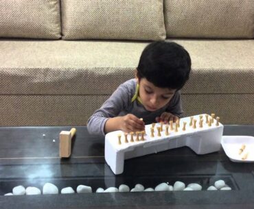 Moksh in Golf Tees Hammering and Marble Balancing Activity: A game for a boost in Concentration