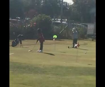 Daughter with the putt.