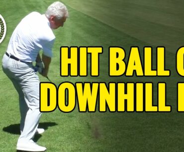 HOW TO HIT A GOLF BALL ON A DOWNHILL LIE
