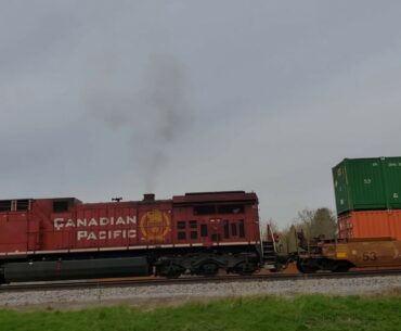 Westbound CP Rail train putters to Pewaukee signal to let Empire Builder through.