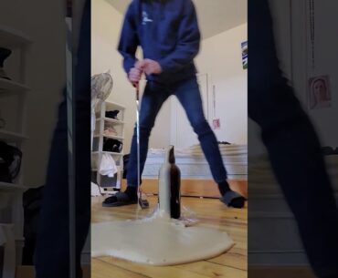 Champagne sabering with golf putter
