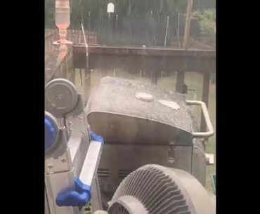 Golf ball sized hail is falling, but girl is more worried about her ribs on the grill.