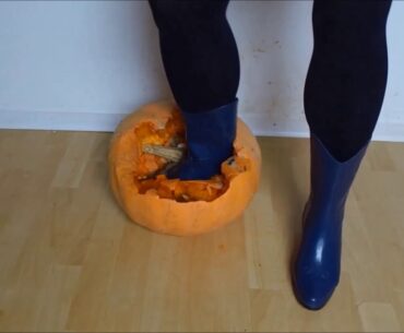 Jana crush a pumpkin with her blue cowgirl rubber boots trailer