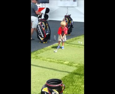 Charlie, son of Tiger Woods shows off golf swing