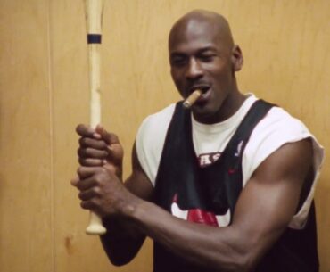 Michael Jordan talking trash with baseball bat and cigar
