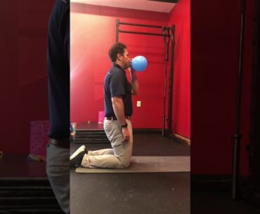 Tall kneeling balloon blowing drill