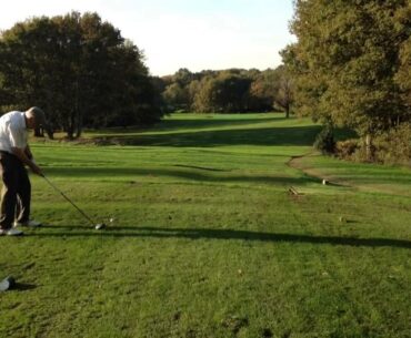 Dad tees off on the 14th
