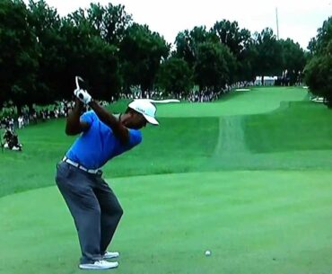 Tiger Woods stops his swing at the Bridgestone Invitational 2013