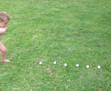 My 2 year old son hitting some golf balls