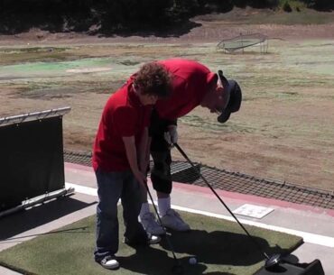 Mr Peters golf camp - Mr Peter teaches Joey the way to grip the golf club