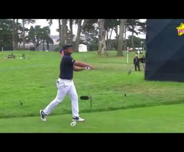 Bryson DeChambeau leans over to pick up his tee on the seventh hole and breaks his driver's head off