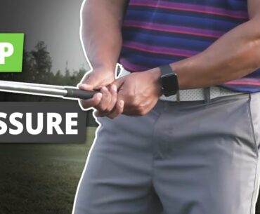 What is the proper grip pressure on a golf club?