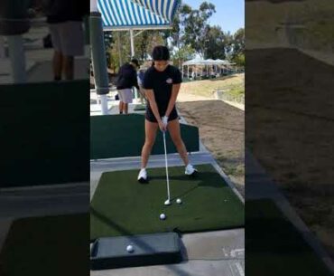 Kat driving golf ball