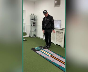 Pete Cowen putting on the  Explanar Putting Mat