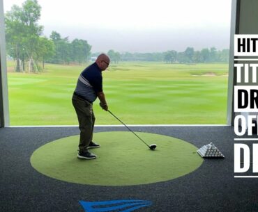 Hitting a Titleist driver off the deck, smooth golf swing, full speed and slomo