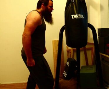 Hitting a sand bag for two times with the bare right fist