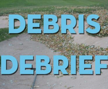 Ball in bunker surrounded by debris