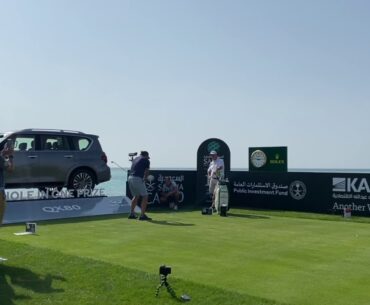 Phil Mickelson hits 1 Iron (right) in Saudi International