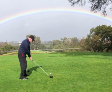 Tee Shot with a rainbow background