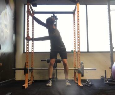 One Arm Cross Body Lat Stretch in Golf Posture