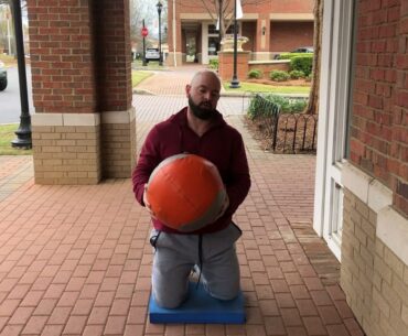 Alternate kneeling scoop med ball slam