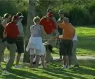 Dumb lady tries to take golf ball that is in play at Doral.flv