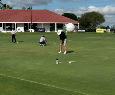Miss Kira P at LIV Golf Orlando at Putting Green watching Scott Vincent of Iron Heads GC at OCN