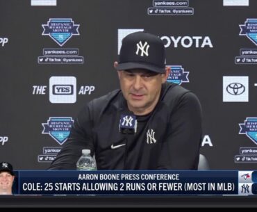 Aaron Boone applauds Gerrit Cole following his outing against the Blue Jays
