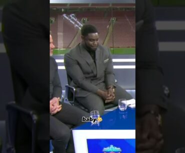 Micah Richards trying not to laugh at Roy Keane