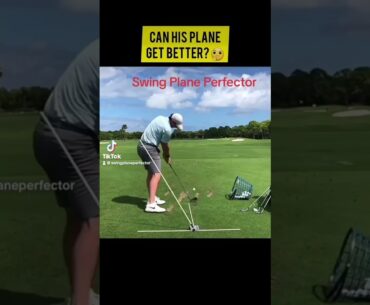 Rory Mcilroy working with golf training aid, Swing Plane Perfector