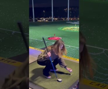 Pretty lady learning golf