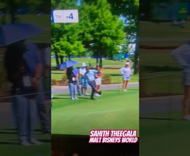Sahith Theegala’s Dad try’s to kick his ball back onto to the green