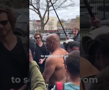 MIKE TYSON RIPS OFF HIS T SHIRT AS SHANNON BRIGGS PUTS IT ON HIM IN NEW YORK