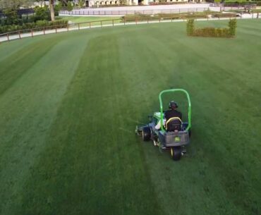 Drone view of mowing turfgrass field with Tchaikovsky (winter of dreams)