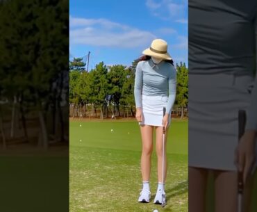 Pretty girl on golf course.