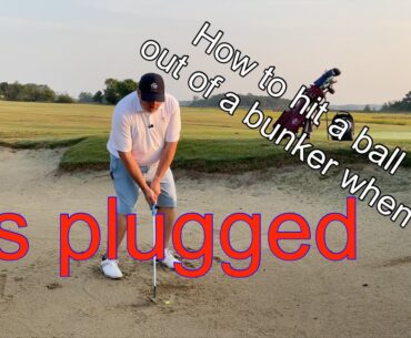 How to hit a ball out of a bunker when it’s plugged