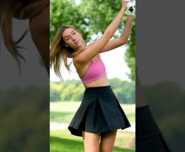 pink top black skirt golf girl