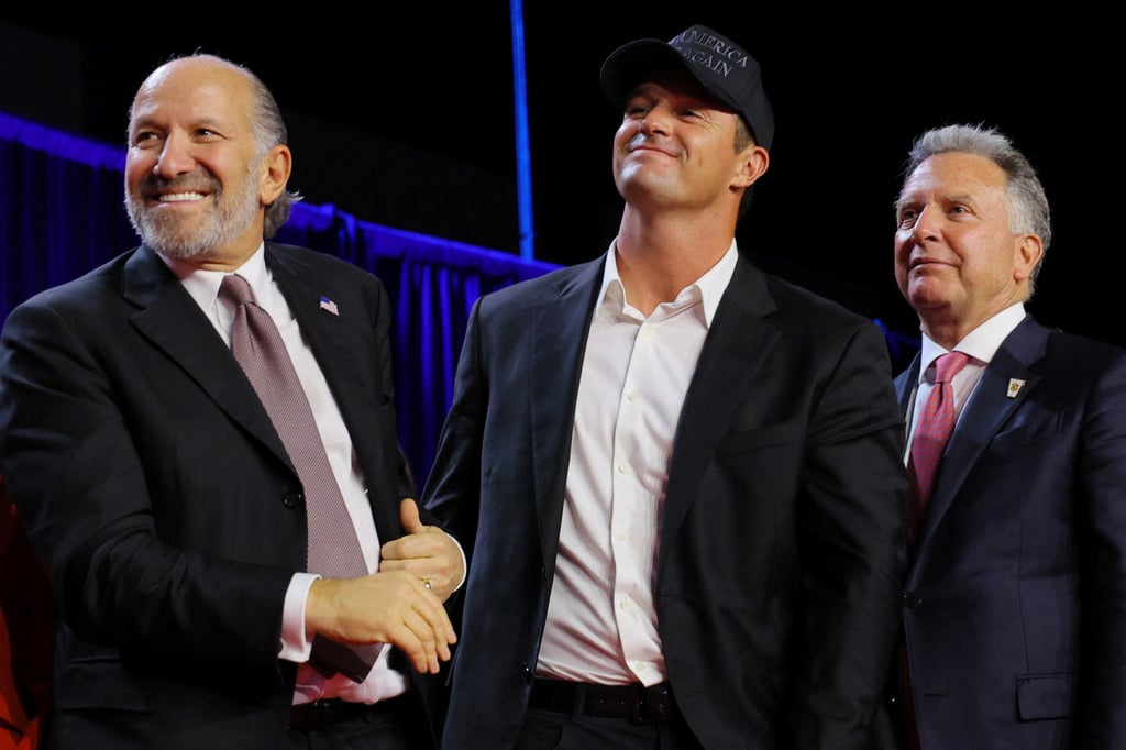 Businessmen Howard Lutnick (left) and Steve Witkoff welcome golfer Bryson DeChambeau to the stage at Republican presidential nominee Donald Trump’s election-night rally in Florida. Photo: Reuters