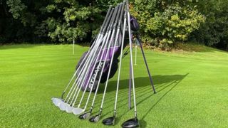 The Strata Ultimate Titanium Women’s Set with clubs laid out on grass