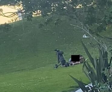 Two golfers were spotted rolling around the fairway of the 16th hole at a small-town golf course in New Zealand (pictured)