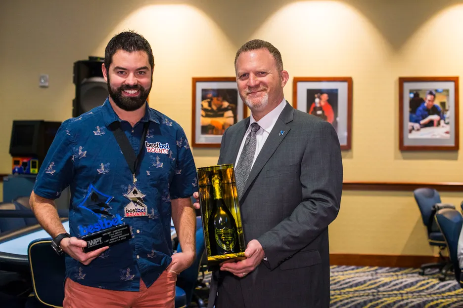 Hollander awarding a Last Bounty Standing award to a young Tyler Patterson in 2016